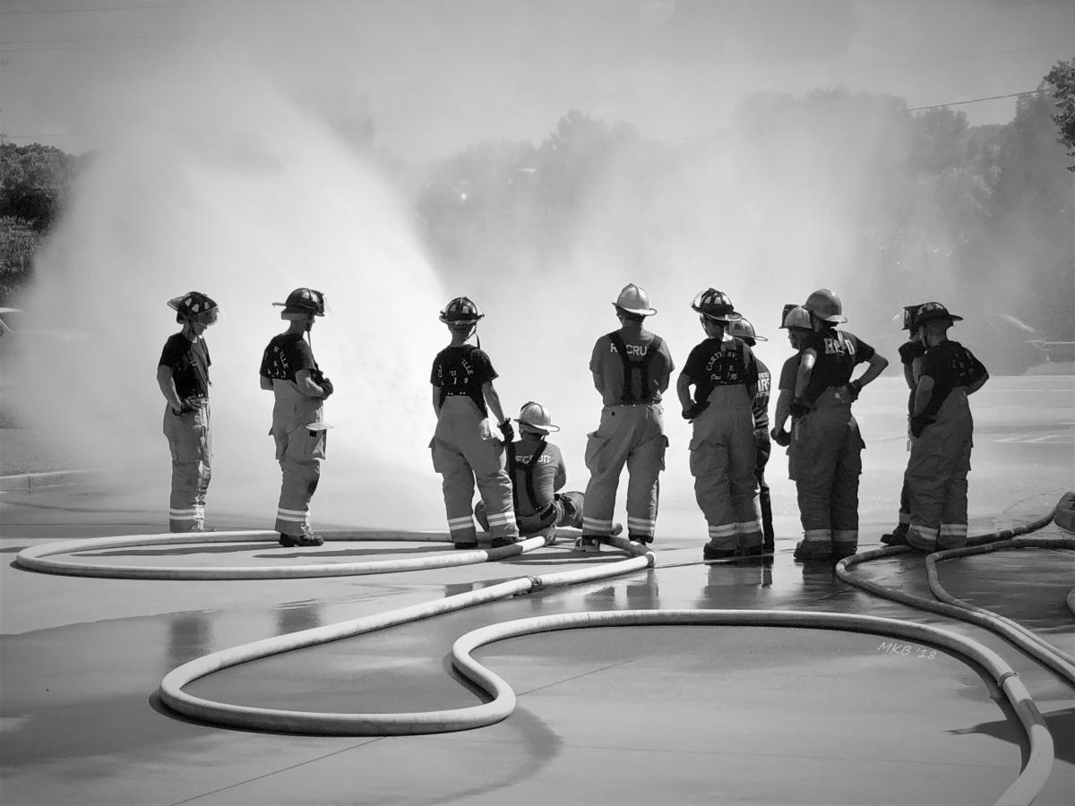 Firefighters Training with Fire Hose
